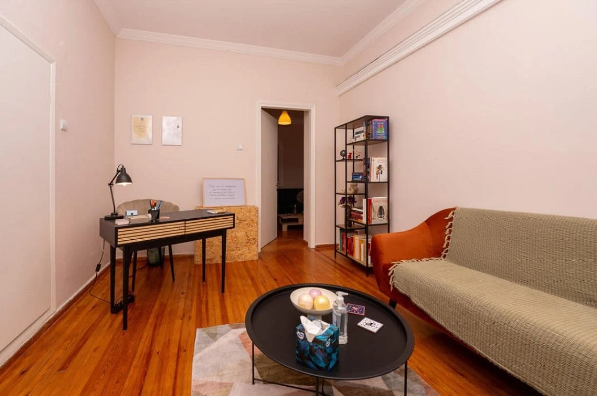 Cozy living area with colorful rug and decorative items